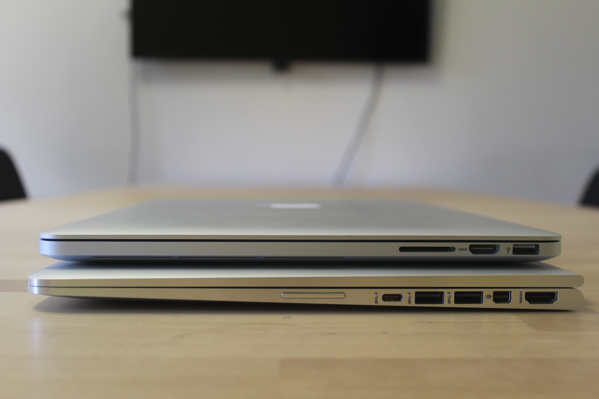 MacBook Pro on top, Spectre x360 on the bottom.