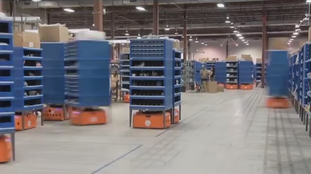 Still shot of Amazon's smart shelves in action from a Kiva Systems YouTube video.