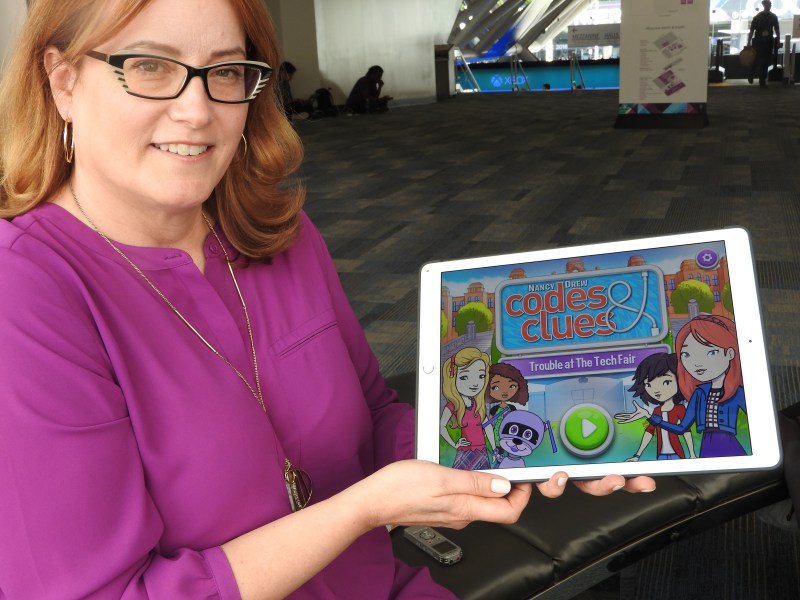 Penny Milliken, CEO of Her Interactive, shows off a Nancy Drew title for young girls.