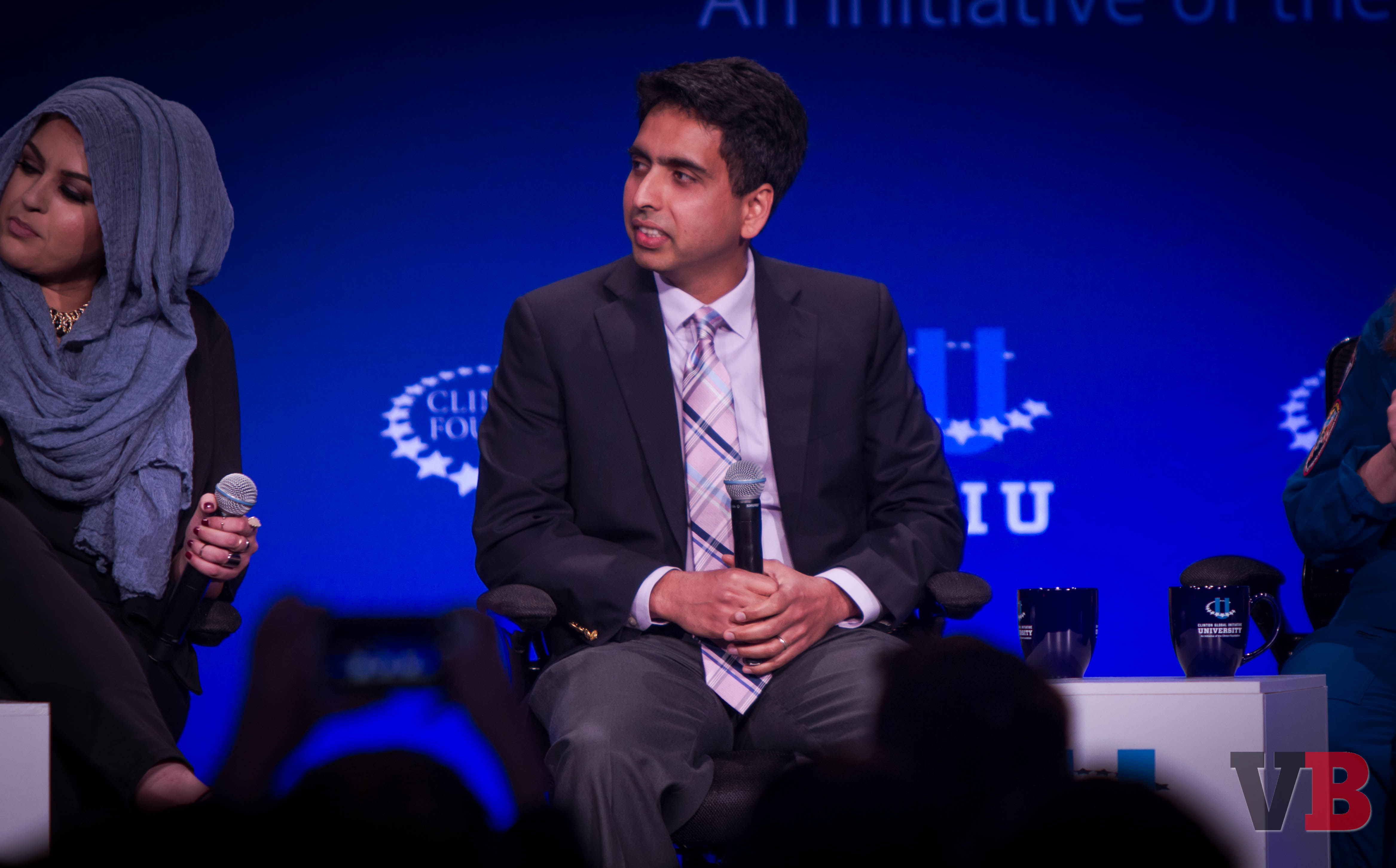 Salman Khan, founder of Khan Academy, listens to a question being asked by President Clinton at the Clinton Global Initiative university event. Held at the University of California, Berkeley campus on April 1, 2016.