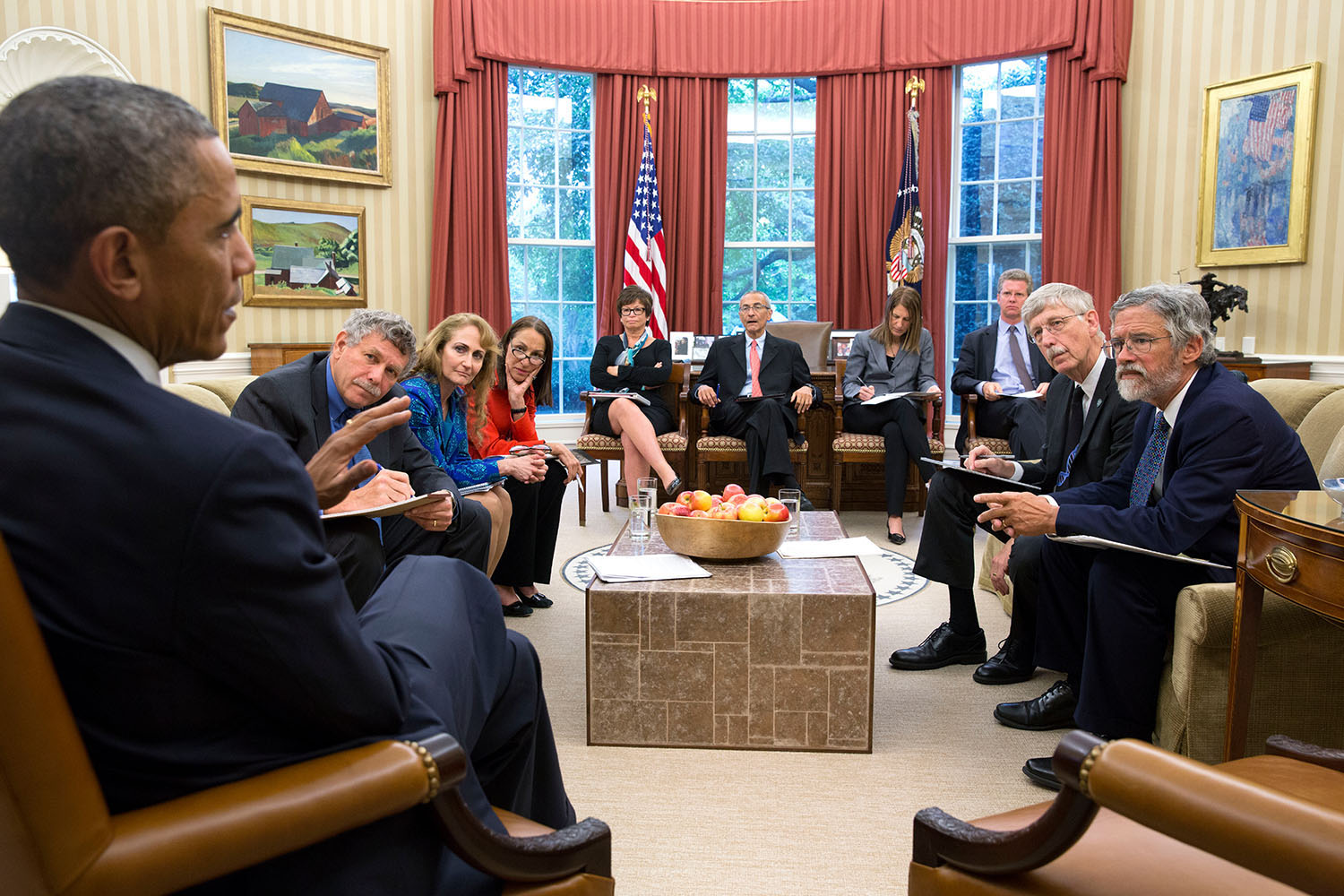 President Barack Obama holds a precision medicine meeting in the Oval Office, Oct. 3, 2014. Seated, from left, are: Eric Lander, Co-Chair, President's Council of Advisors on Science and Technology; Jo Handelsman, Associate Director for Science, Office of Science and Technology Policy; Margaret Hamburg, FDA Commissioner; Senior Advisor Valerie Jarrett; John Podesta, Counselor to the President; Health and Human Services Secretary Sylvia Mathews Burwell; Shaun Donovan, Director, Office of Management and Budget; Francis Collins, Director, National Institutes of Health; and Dr. John Holdren, Director of the Office of Science and Technology Policy. (Official White House Photo by Pete Souza) This official White House photograph is being made available only for publication by news organizations and/or for personal use printing by the subject(s) of the photograph. The photograph may not be manipulated in any way and may not be used in commercial or political materials, advertisements, emails, products, promotions that in any way suggests approval or endorsement of the President, the First Family, or the White House.