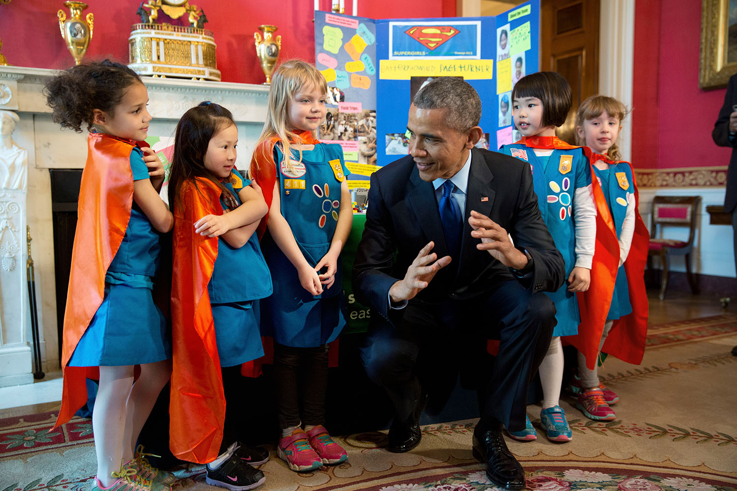 President Barack Obama views science exhibits during the 2015 White House Science Fair celebrating student winners of a broad range of science, technology, engineering, and math (STEM) competitions, in the Red Room, March 23, 2015. The President talks with Emily Bergenroth, Alicia Cutter, Karissa Cheng, Addy O'Neal, and Emery Dodson, all six-year-old Girl Scouts, from Tulsa, Oklahoma. They used Lego pieces and designed a battery-powered page turner to help people who are paralyzed or have arthritis. (Official White House Photo by Chuck Kennedy) This official White House photograph is being made available only for publication by news organizations and/or for personal use printing by the subject(s) of the photograph. The photograph may not be manipulated in any way and may not be used in commercial or political materials, advertisements, emails, products, promotions that in any way suggests approval or endorsement of the President, the First Family, or the White House.