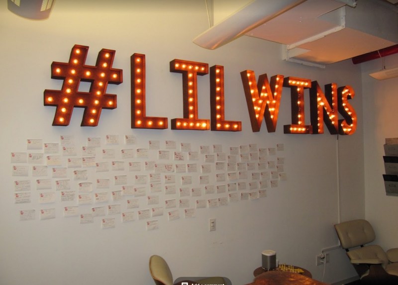 Arkadium's wall of "lil wins' sticky notes.