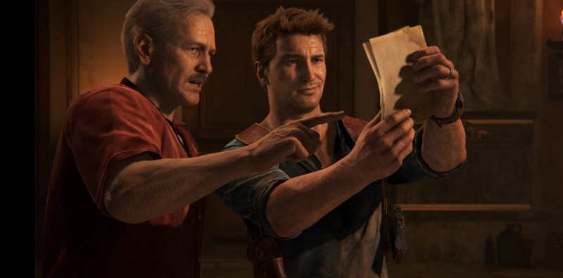 Sully and Nathan Drake share a moment of discovery in Uncharted 4: A Thief's End.