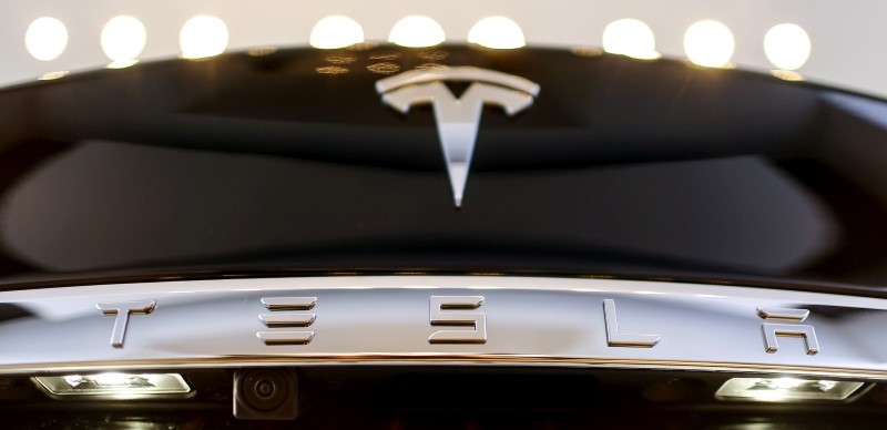 A Tesla logo adorns a 'Model S' car in the dealership in Berlin, Germany, November 18, 2015.