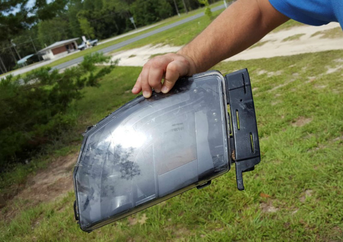 This is a photo of Robert VanKavelaar shows a piece of the Tesla found in his property where the Tesla came to rest when its driver was killed in a collision with a truck in May in Williston, Florida, U.S. July 1, 2016.