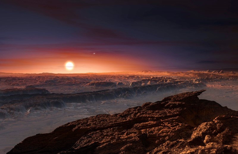 A view of the surface of the planet Proxima b orbiting the red dwarf star Proxima Centauri, the closest star to our Solar System, is seen in an undated artist's impression released by the European Southern Observatory August 24, 2016.   ESO/M. Kornmesser/Handout via Reuters