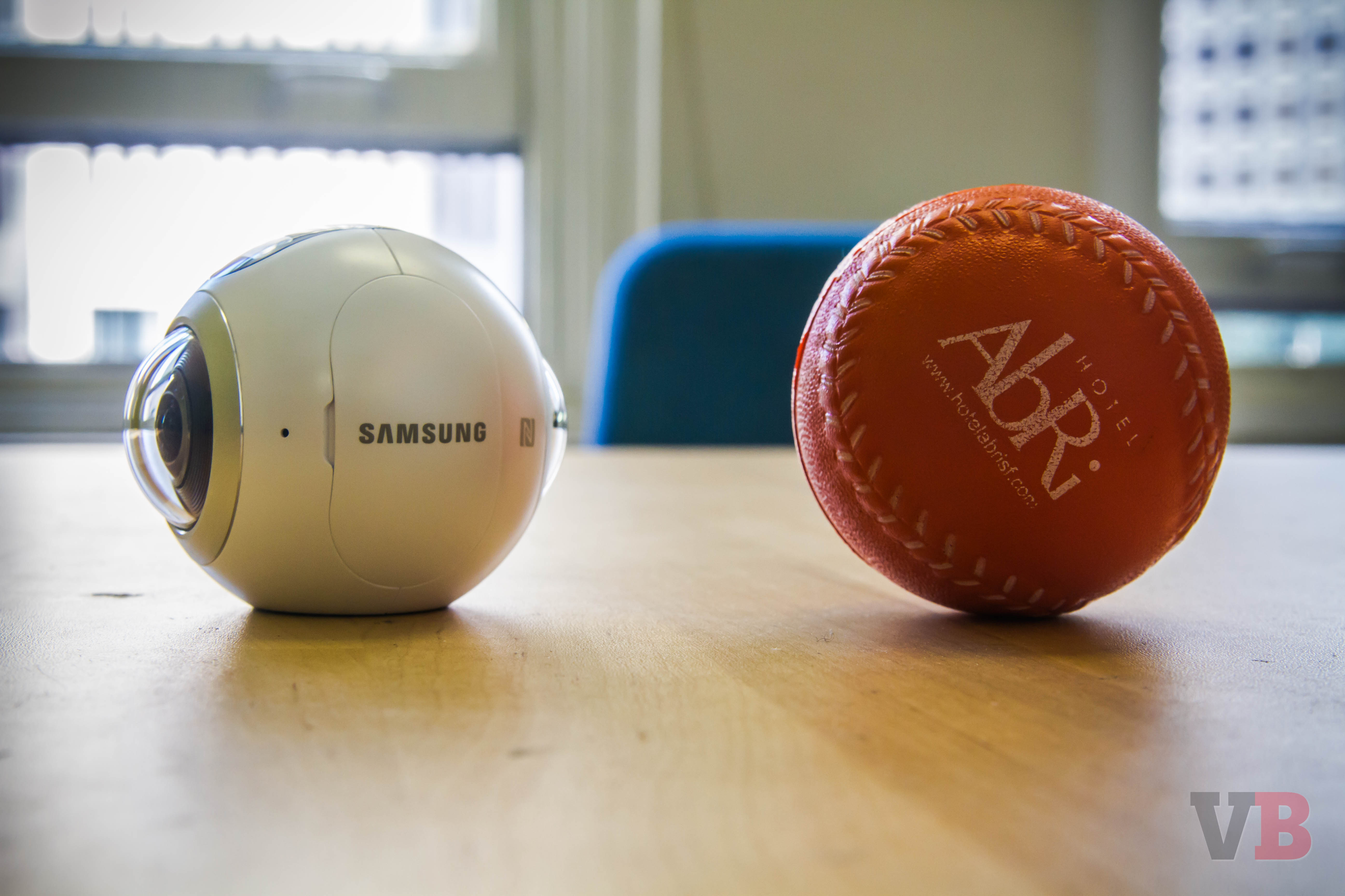 Comparing the size of the Samsung Gear 360 with a ball.