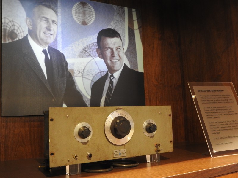 Dave Packard and Bill Hewlett with their first product at HP: the oscillator used in Disney's Fantasia.