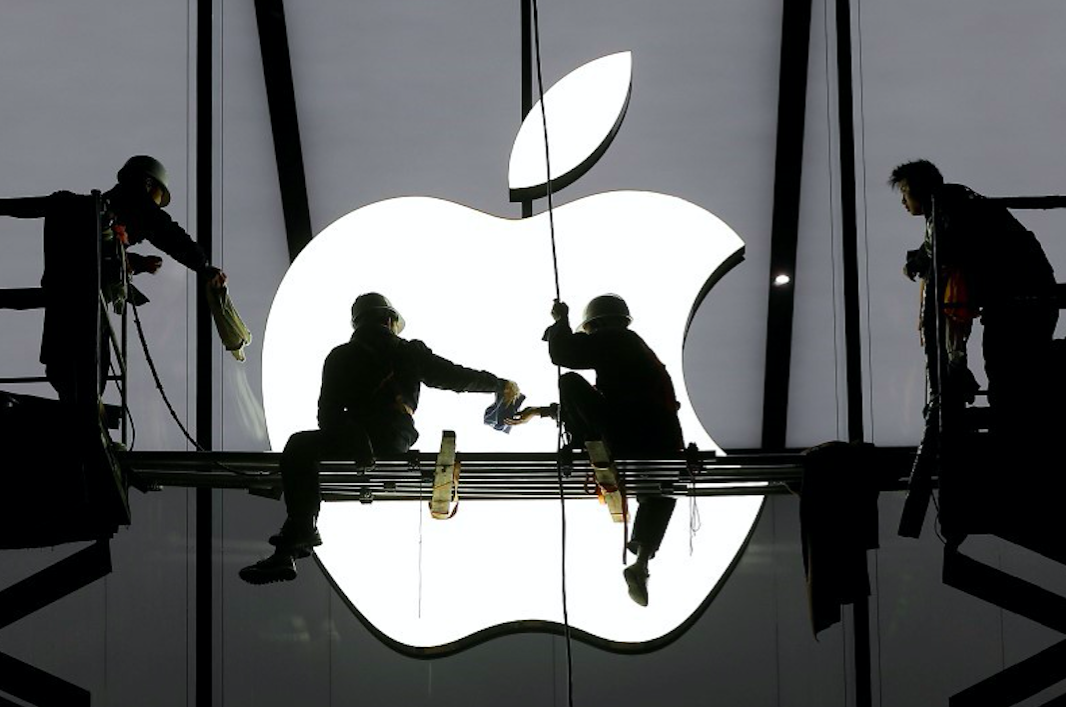 This photo shows workers prepare for the opening of an Apple store in Hangzhou, Zhejiang province, January 23, 2015.