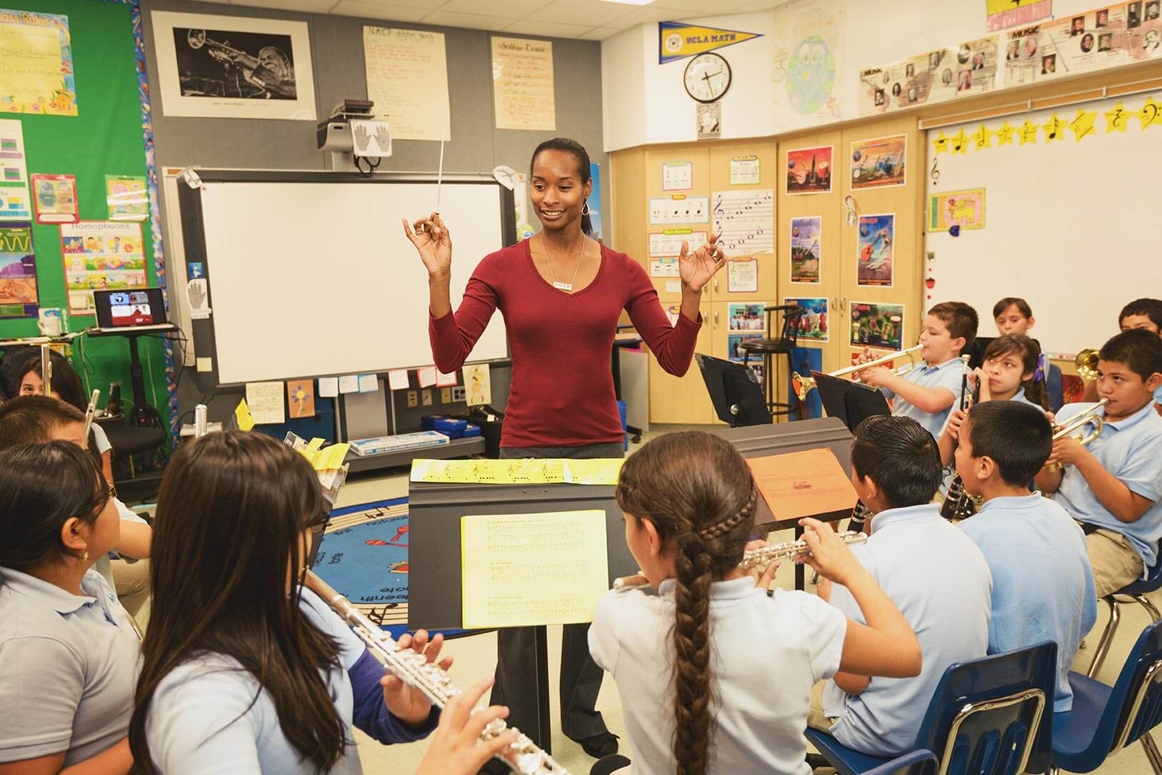 New Academy Elementary School teacher Genuine Letford leads students in her music class.