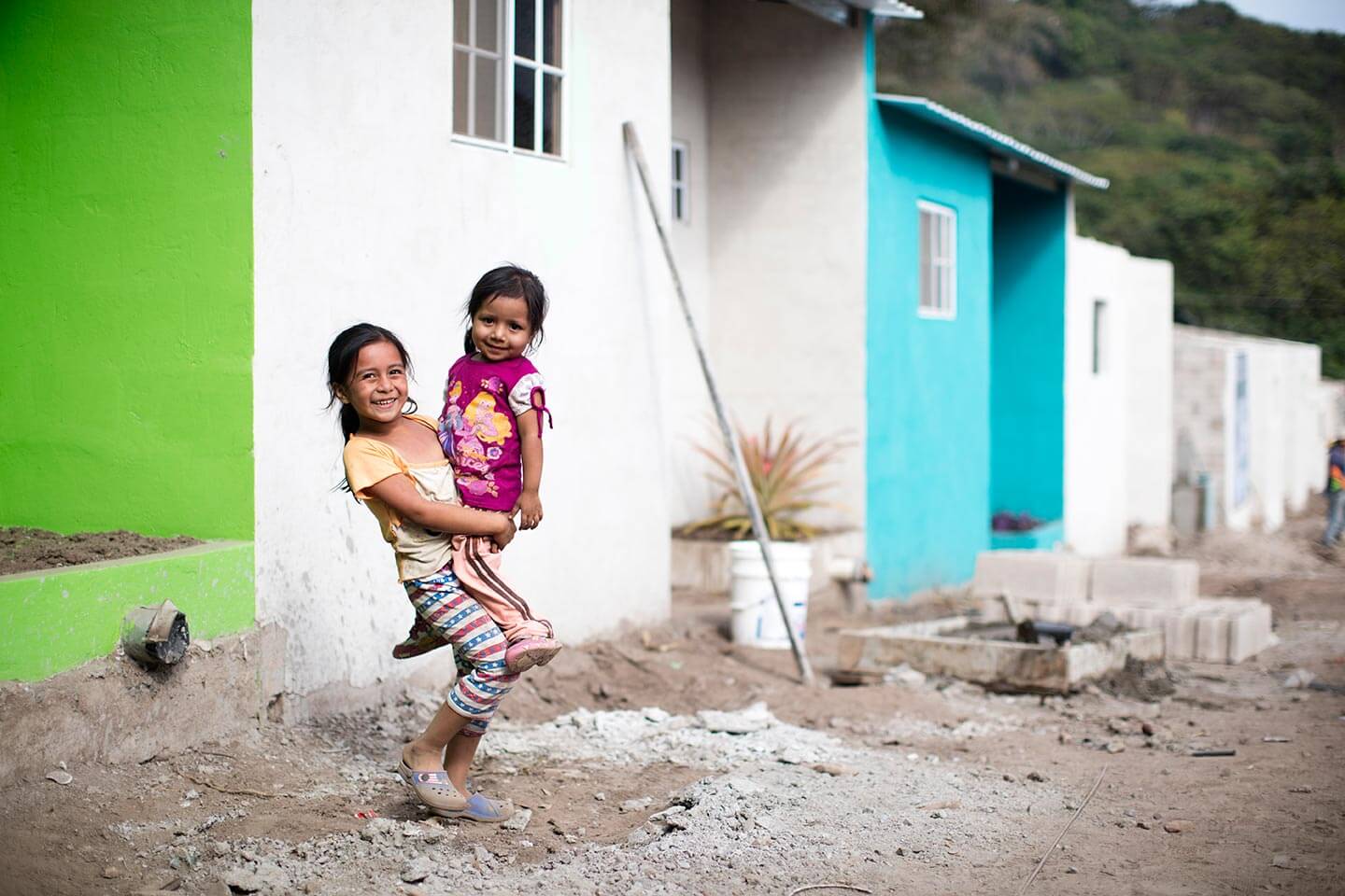 A family celebrates their new home in El Salvador.