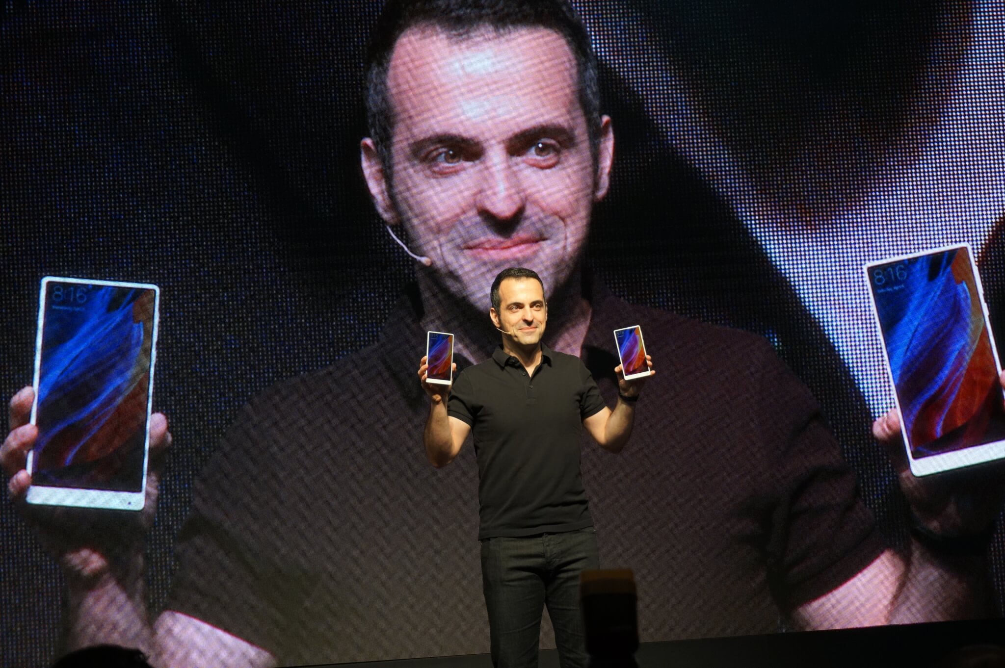 Xiaomi's Hugo Barra holds up the white version of the Mi Mix smartphone.