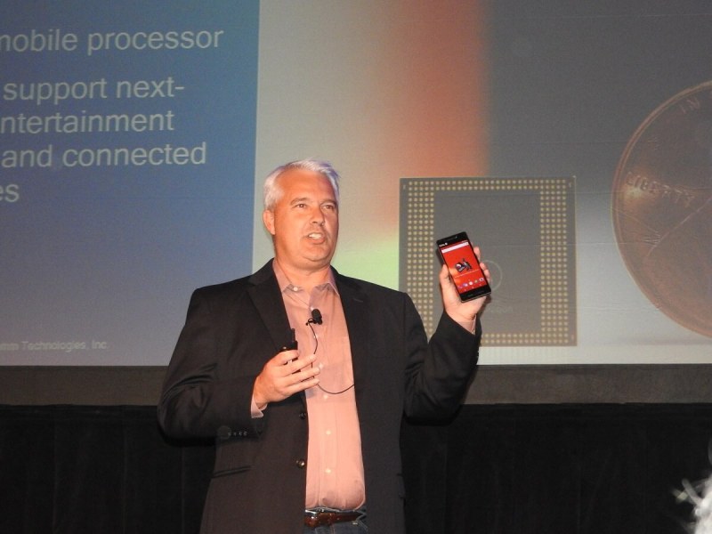 Ken Kressin of Qualcomm shows off the Snapdragon 835 chip in a reference design phone.