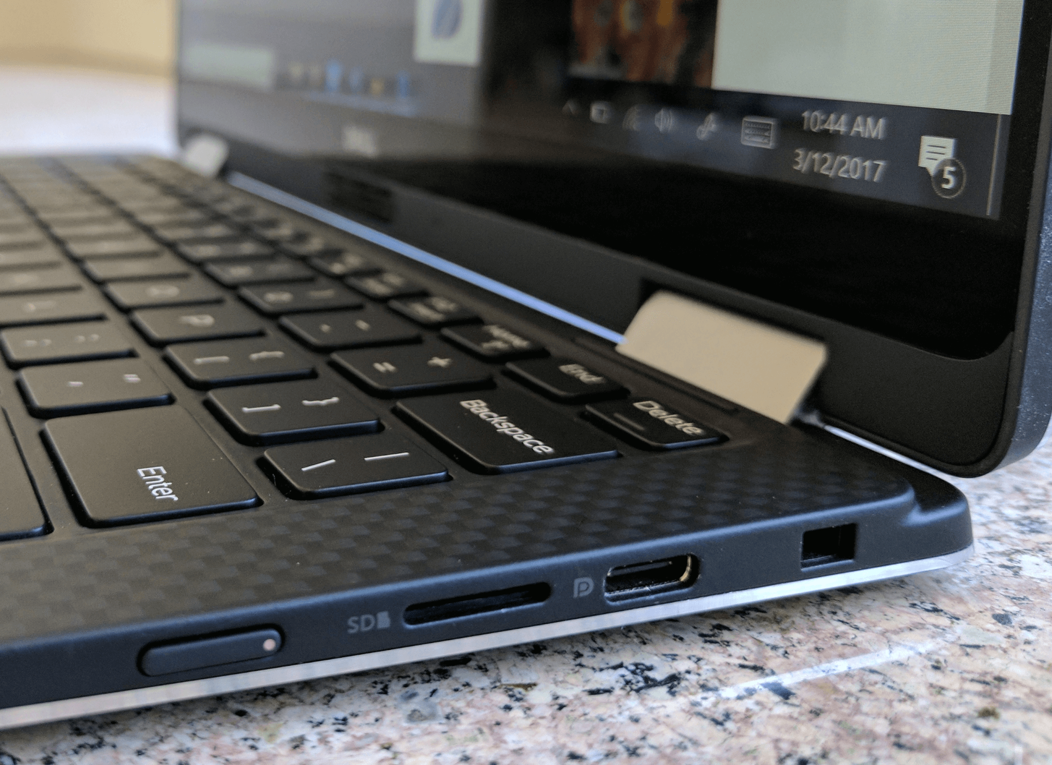The power button is barely sticking out on the side of the computer.