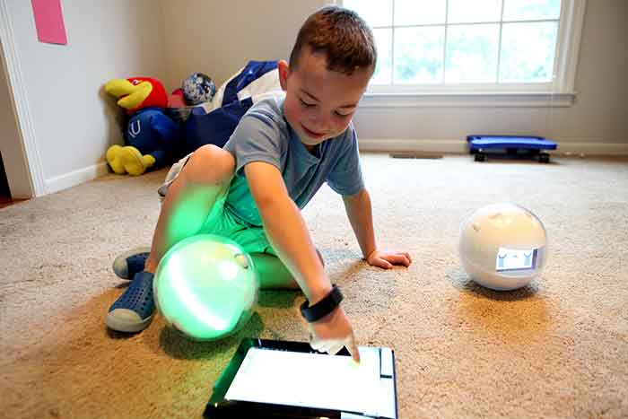 Leka’s unique spherical design allow the robot to be safely handled and engage in unique play with special needs children. Image Credit: Leka, Inc / Ladislas de Toldi.