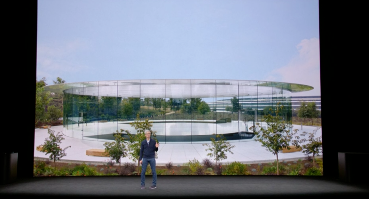 Apple CEO Tim Cook speaking at Steve Jobs Theater.