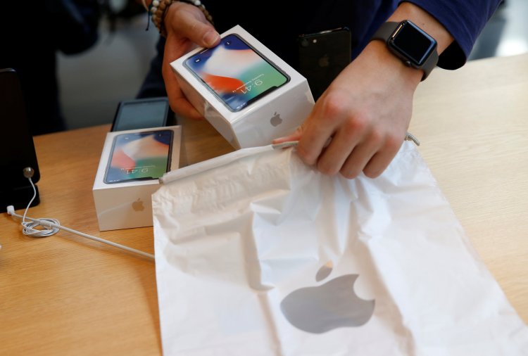 Apple Store staff prepares to sell Apple's  iPhone X. Japan, November 3, 2017.