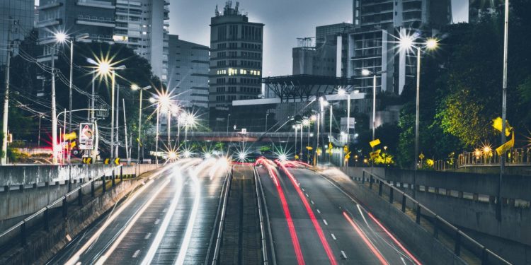 autonomous vehicles concept, light trails on road.