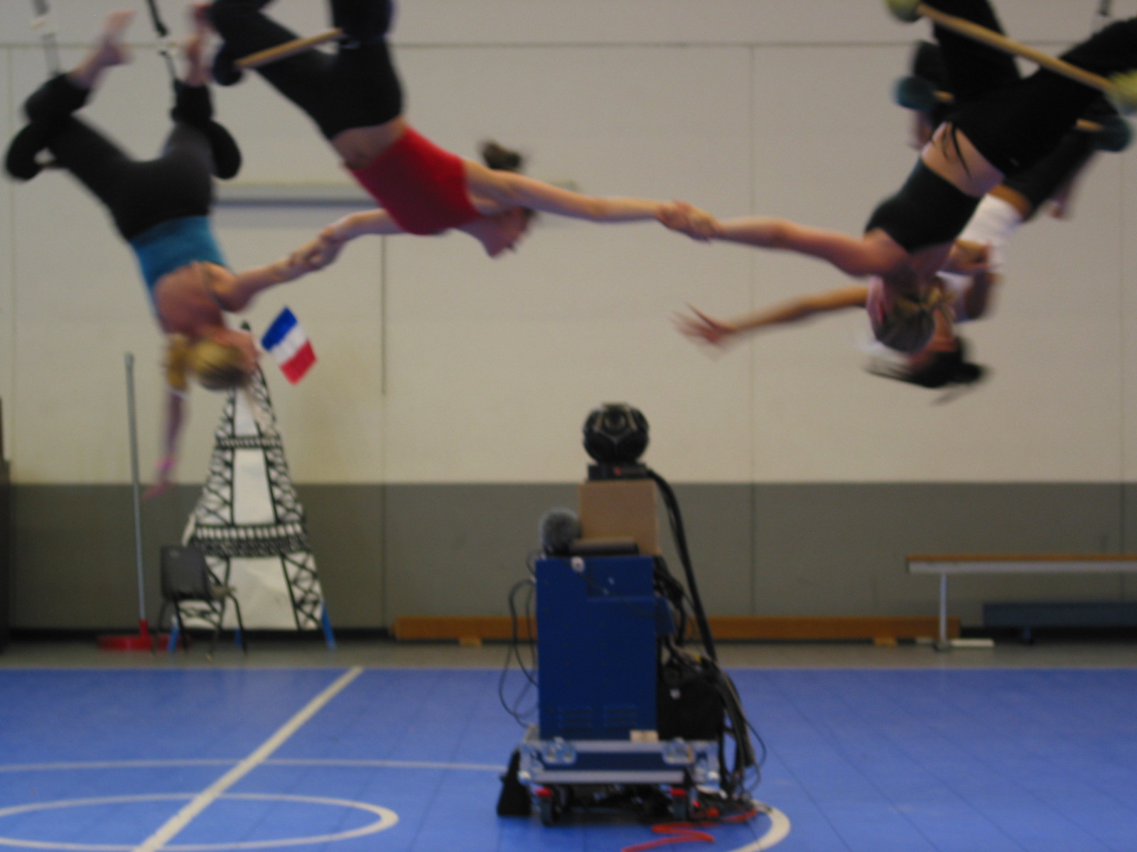 An aerial dance troupe in Portland performs around one an early immersive camera in 2002