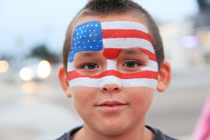 A young boy celebrates July 4 holiday in Imperial Beach, California