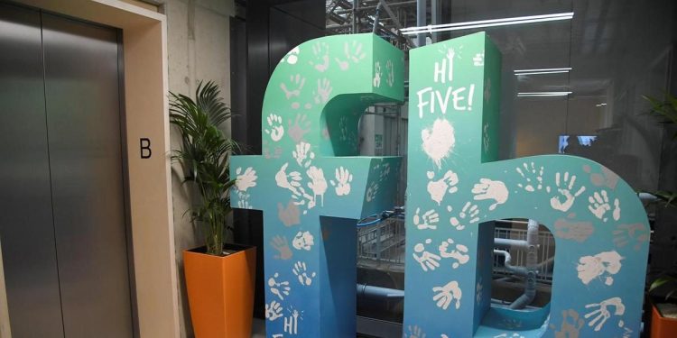 A giant logo is seen at Facebook's headquarters in London. Facebook is opening a new office, providing an extra 800 jobs. 