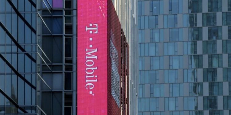 A T-Mobile logo is advertised on a building sign in Los Angeles, California.
