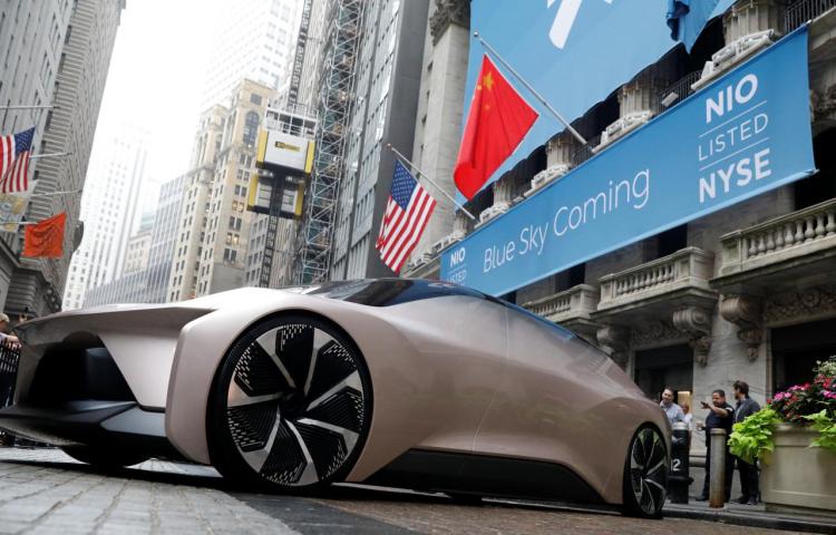 Chinese electric vehicle start-up Nio Inc. vehicle is parked in front of the New York Stock Exchange (NYSE) to celebrate the company’s initial public offering (IPO) in New York, U.S., September 12, 2018.  