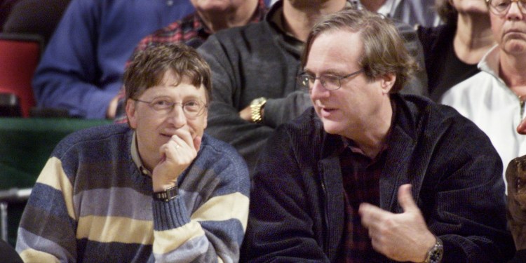 Microsoft co-founders Bill Gates and Paul Allen chat at courtside during the NBA game between the Seattle SuperSonics and the Portland Trailblazers at Key Arena in Seattle.