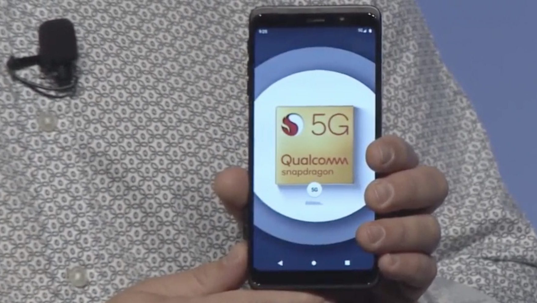 Qualcomm President Cristiano Amon shows off the company's first live 5G reference phone design.