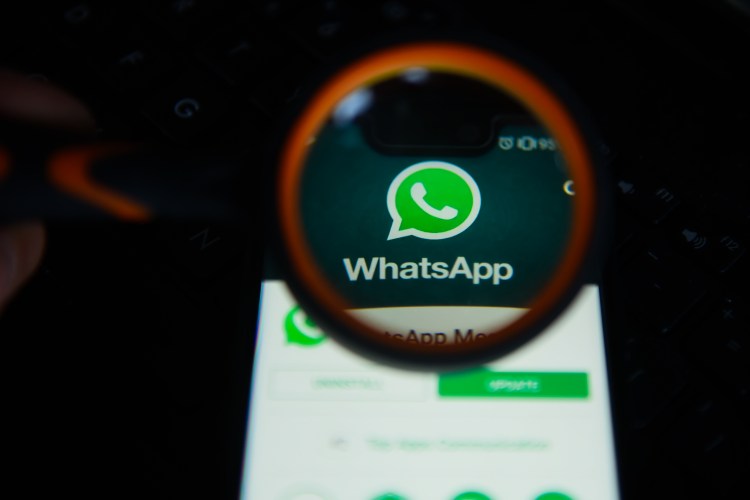 KRAKOW, POLAND - 2018/09/07: WhatsApp logo is seen through a magnifying glass on an android mobile phone. (Photo by Omar Marques/SOPA Images/LightRocket via Getty Images)