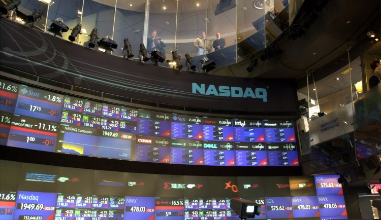 386567 09: A television reporter explains the drop in the Nasdaq March 12, 2001 at the Nasdaq MarketSite in New York City as pedestrians look down into the studio from windows above. The NASDAQ composite index dropped below 2000 for the first time in 27 months as investors, uneasy about the prospects for a quick economic recovery, again punished technology stocks. (Photo by Spencer Platt/Newsmakers)