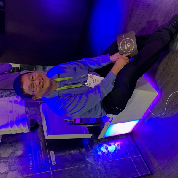 Dean Takahashi sitting on the Kohler Numi 2.0 smart toilet.