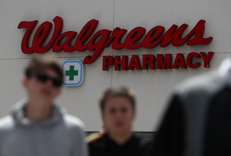 Pedestrians walk by a Walgreens store on June 29, 2017 in San Francisco, California. 