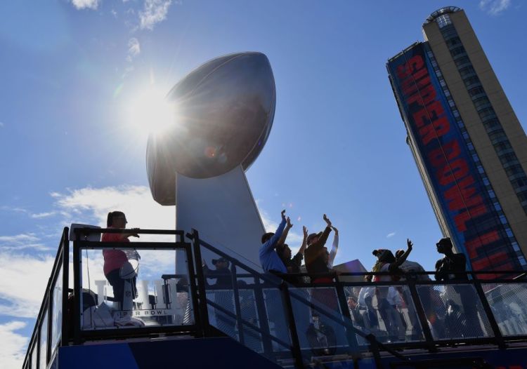 Fans dance during the Super Bowl Experience in Atlanta, Georgia on February 2, 2019. The New England Patriots will meet the Los Angeles Ram at Super Bowl LIII on February 3rd.