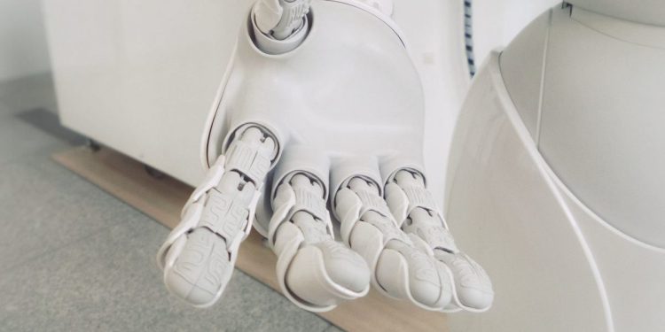 The extended hand of a humanoid robot