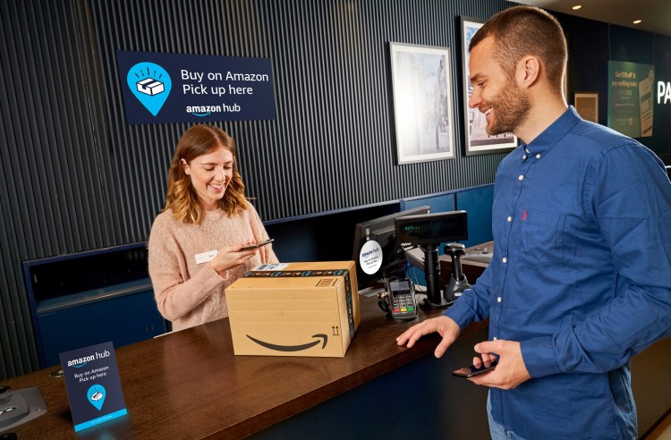 Amazon customer collecting a purchase in a Next retail store.