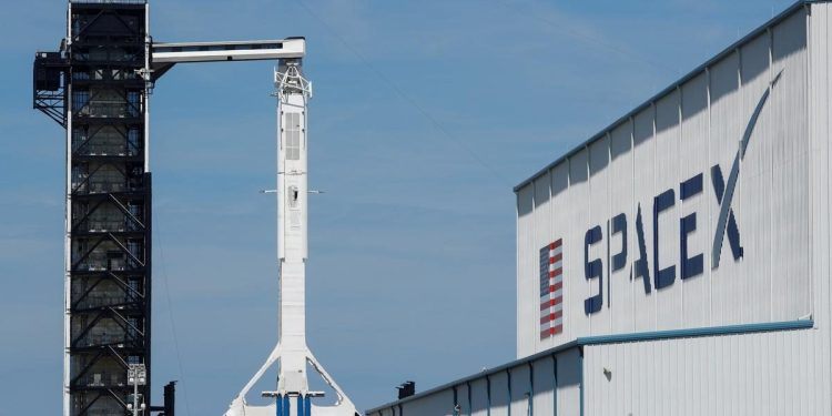 FILE PHOTO: A SpaceX Falcon 9 carrying the Crew Dragon spacecraft sits on launch pad 39A prior to the uncrewed test flight to the International Space Station. March 1, 2019. 