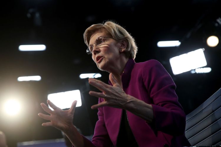 MIAMI, FLORIDA - JUNE 26: Sen. Elizabeth Warren (D-MA) speaks to the media in the spin room following the first night of the Democratic presidential debate on June 26, 2019 in Miami, Florida.  A field of 20 Democratic presidential candidates was split into two groups of 10 for the first debate of the 2020 election, taking place over two nights at Knight Concert Hall of the Adrienne Arsht Center for the Performing Arts of Miami-Dade County, hosted by NBC News, MSNBC, and Telemundo.
