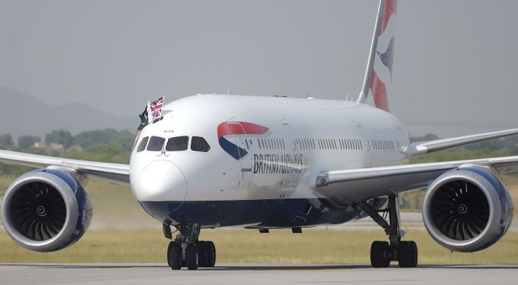 A British Airways aircraft taxies on a runway with the Pakistani (L) and Union Jack flags upon landing at the Islamabad International Airport on the outskirts of Islamabad on June 3, 2019