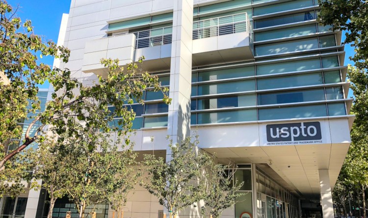 Silicon Valley offices of the United States Patent and Trademark (USPTO) at 26 South Fourth Street in San Jose, California, surrounded by trees. Located at the corner of South 4th Street and East Santa Clara Street in San Jose in the San Francisco Bay Area.