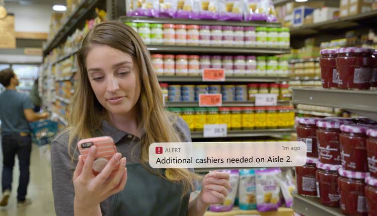 A store clerk responds to an alert from Microsoft Dynamics 365 