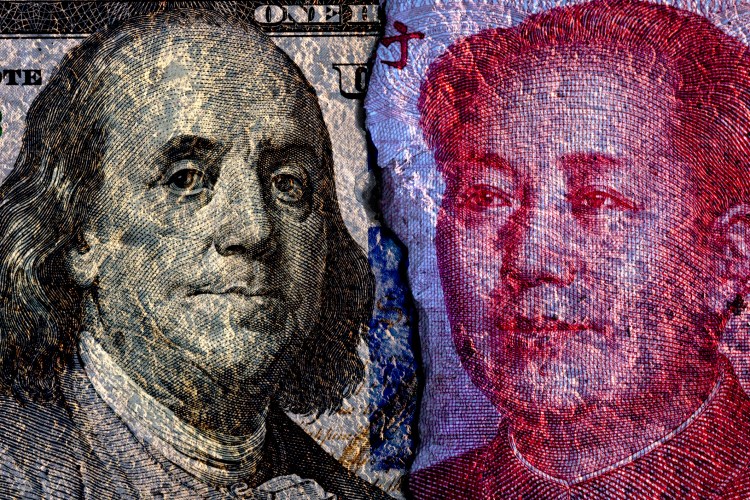 Closeup of cracked of Face to face of US dollar banknote and China Yuan banknote for 2 biggest economic in the world which now United states of America and China have war trade.Both countries conflict