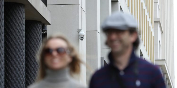 LONDON, ENGLAND - AUGUST 16: People walk past a CCTV camera in Pancras Square near Kings Cross Station on August 16, 2019 in London, England. CCTV cameras using facial-recognition systems at King's Cross are to be investigated by the UK's data-protection watchdog after a report by the Financial Times. (Photo by Dan Kitwood/Getty Images)