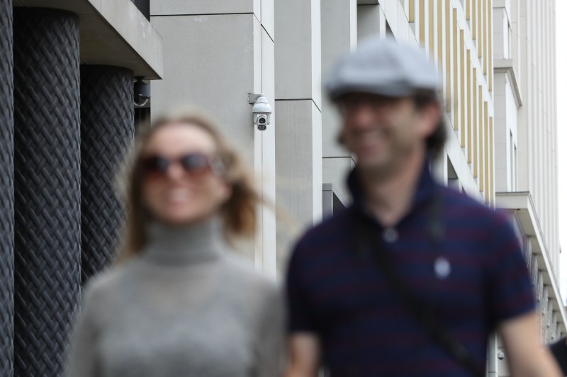 LONDON, ENGLAND - AUGUST 16: People walk past a CCTV camera in Pancras Square near Kings Cross Station on August 16, 2019 in London, England. CCTV cameras using facial-recognition systems at King's Cross are to be investigated by the UK's data-protection watchdog after a report by the Financial Times. (Photo by Dan Kitwood/Getty Images)