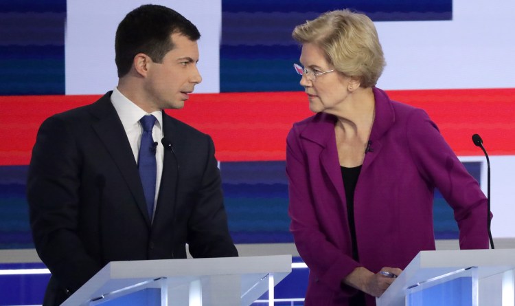South Bend, Indiana Mayor Pete Buttigieg and Sen. Elizabeth Warren (D-MA) speak during the Democratic Presidential Debate at Tyler Perry Studios November 20, 2019 in Atlanta, Georgia. Ten Democratic presidential hopefuls were chosen from the larger field of candidates to participate in the debate hosted by MSNBC and The Washington Post.