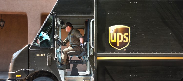 SANTA FE, NEW MEXICO - AUGUST 1, 2018: A UPS (United Parcel Service) truck driver makes a delivery in Santa Fe, New Mexico.