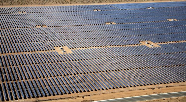 FILE PHOTO: An array of solar panels is seen in the desert near Victorville, California, U.S. March 28, 2018.