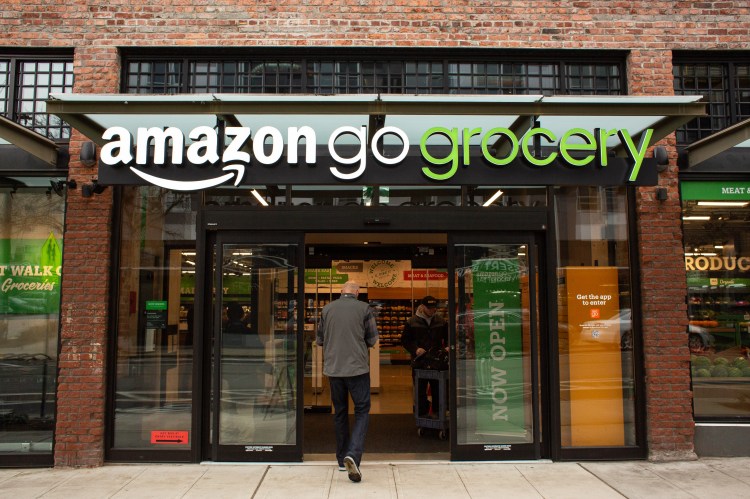SEATTLE, WA - FEBRUARY 26: A shopper enters Amazon Go Grocery on February 26, 2020 in Seattle, Washington. The store in Seattle's Capitol Hill neighborhood is Amazon's first large retail grocery location that uses the cashier-free model.