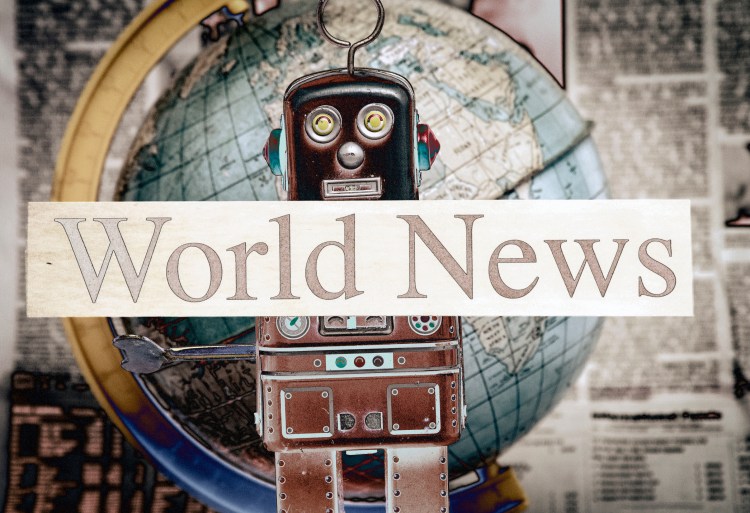 tin bot holding up a 'world news' sign